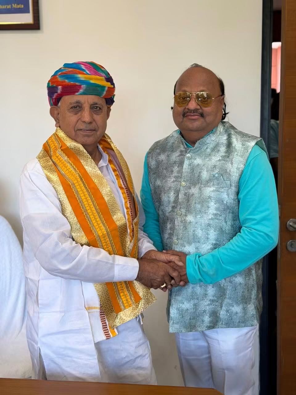 Pyarelal Gundecha felicitating a distinguished honorable official — Yash Veera Films